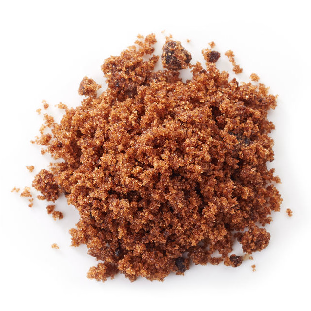 brown muscovado sugar on a white background